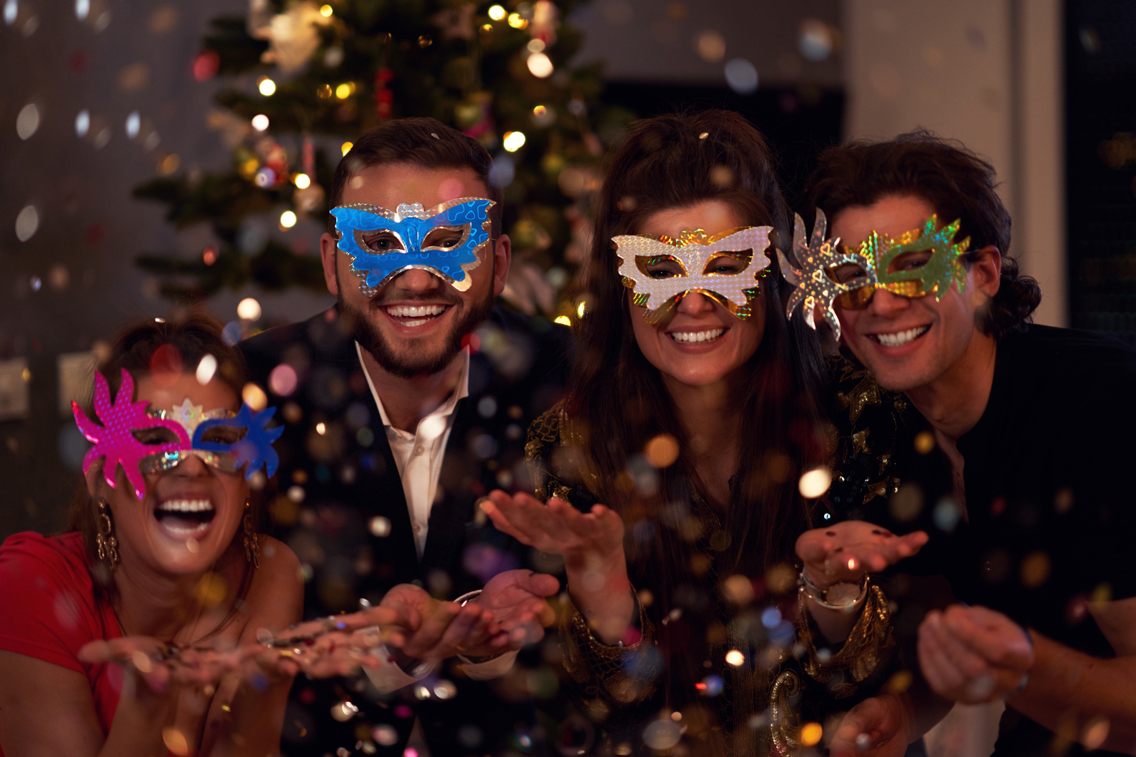 Group of Friends Having Masquerade Party During Holidays 
